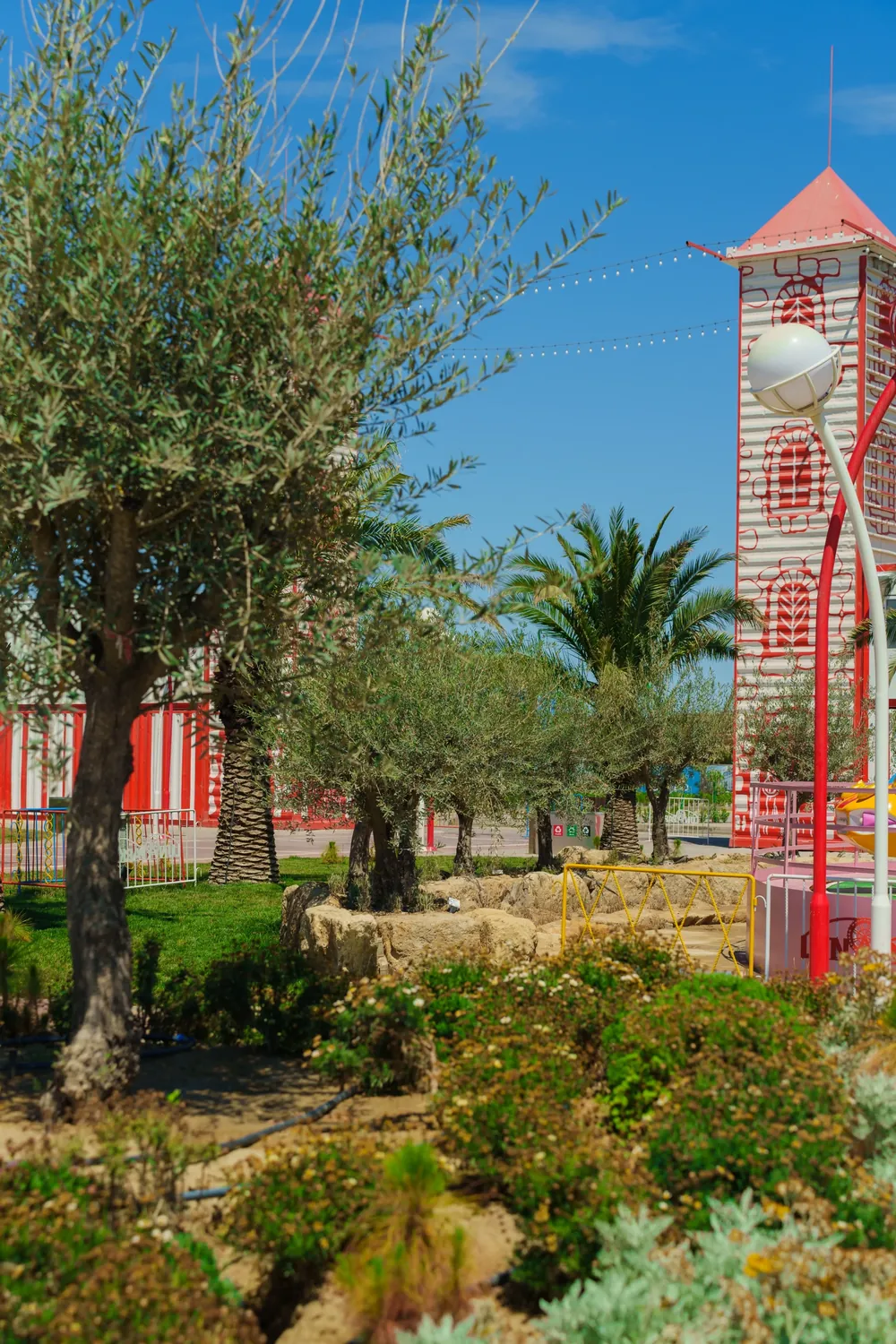 The tower behind the olive trees